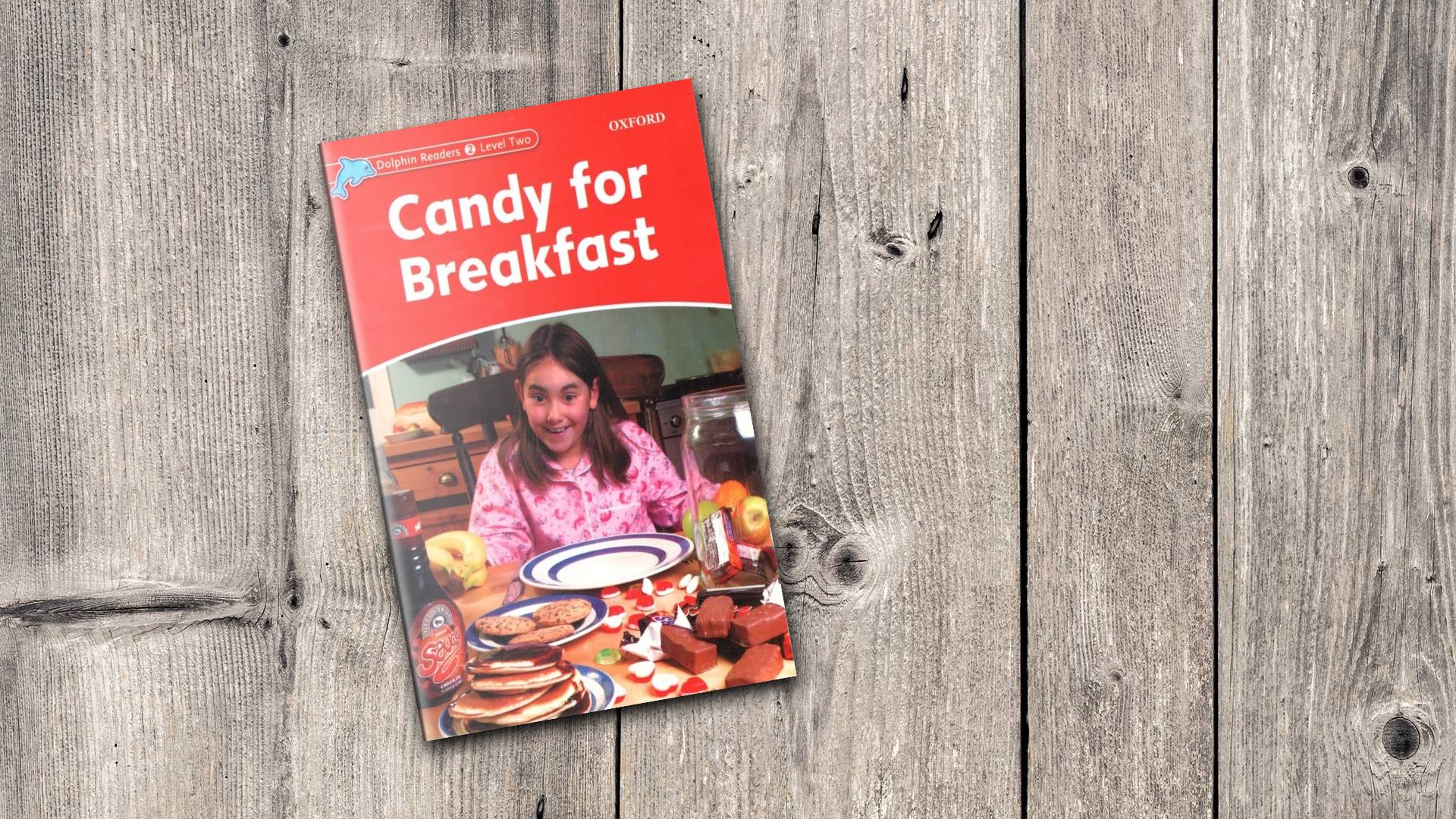 خرید کتاب زبان | فروشگاه اینترنتی کتاب زبان | Dolphin Readers 2 Level Two Candy for Breakfast | داستان دلفین ریدرز دو آب نبات برای صبحانه